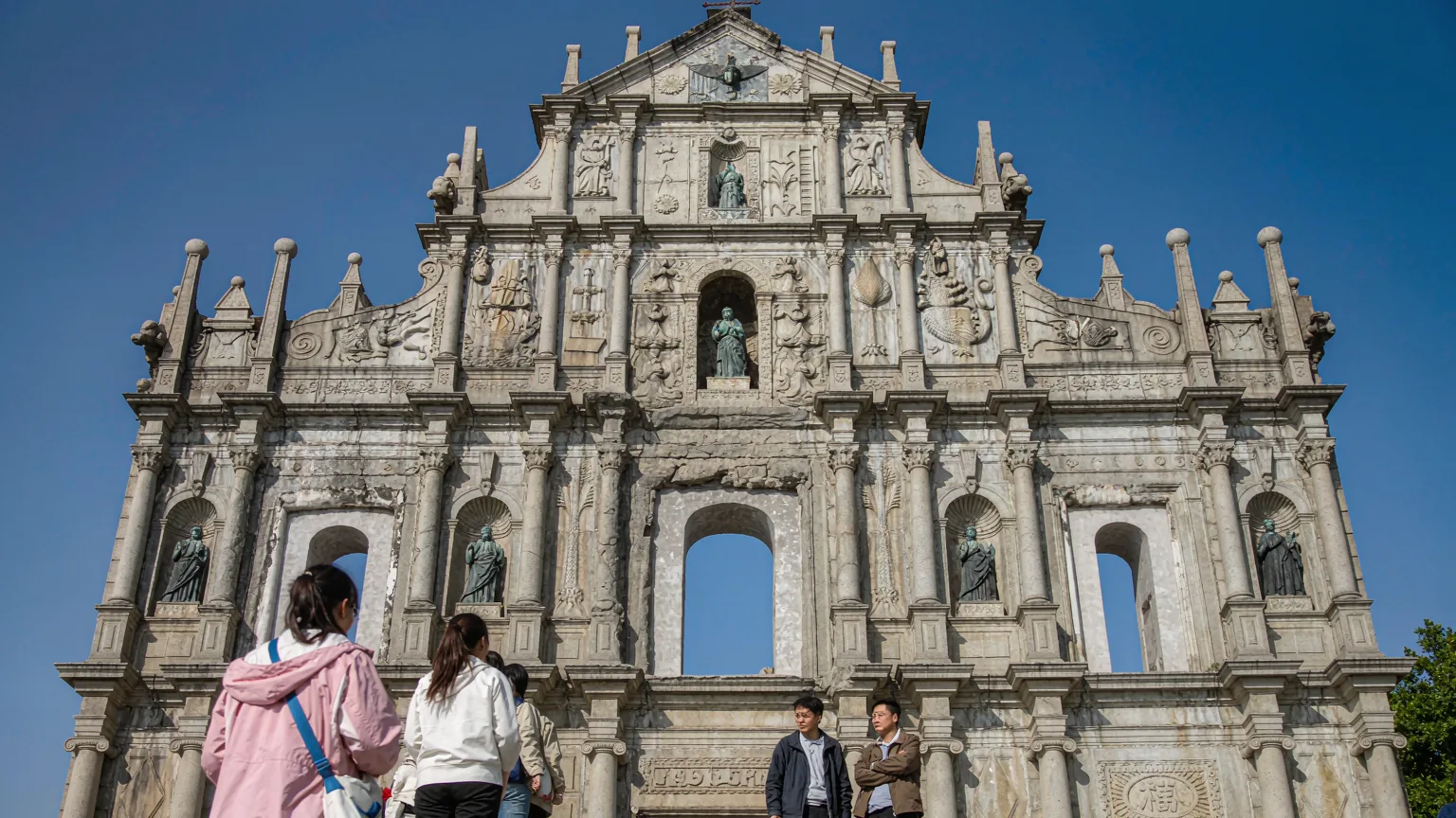 Five-tiered granite facade of Ruins of St. Paul's with Asian motifs