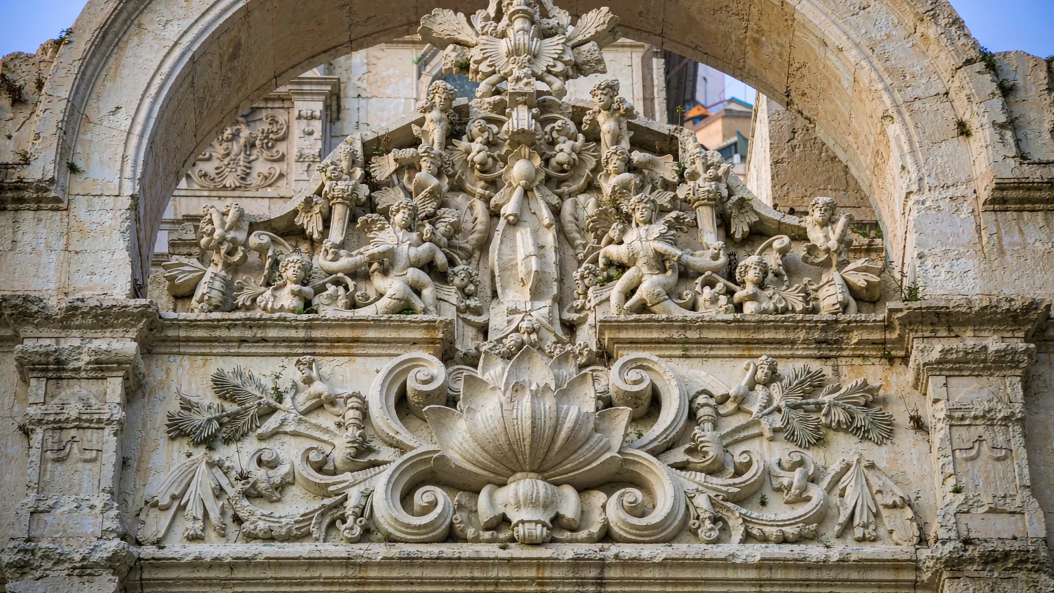Close-up of lotus flower and Chinese carvings on St. Paul's facade