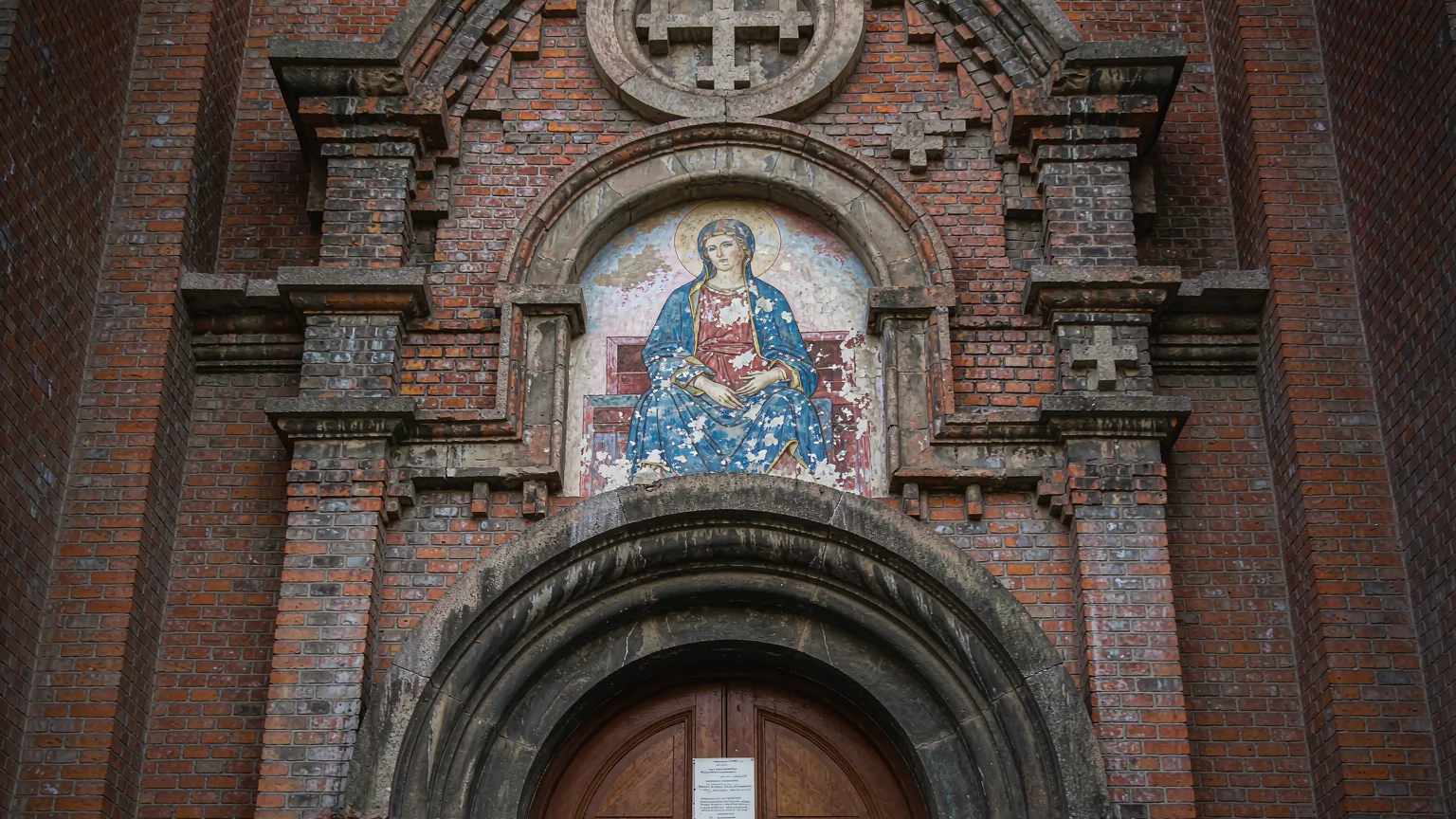 Close-up of weathered brick and faded fresco on Saint Sophia Cathedral