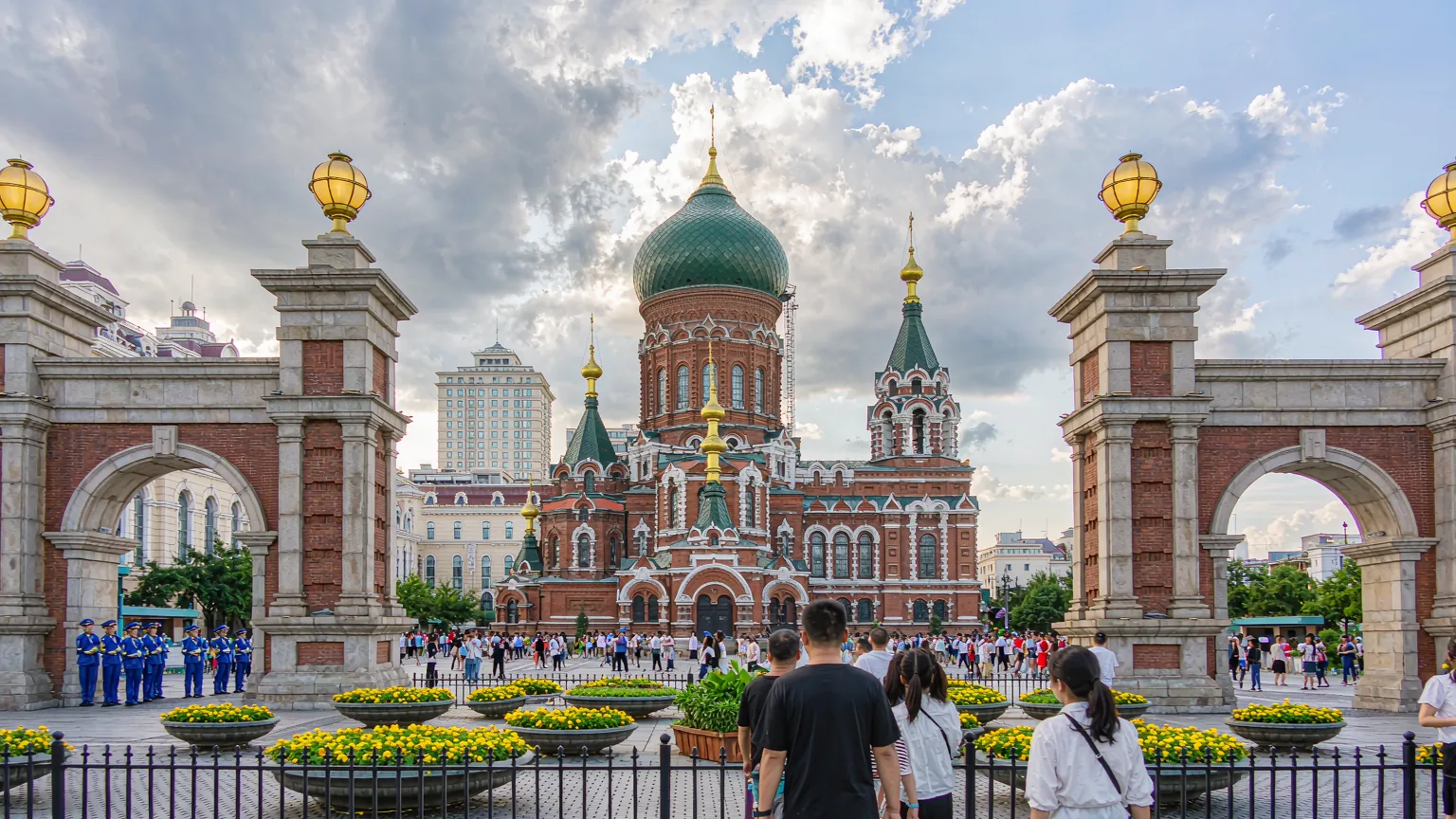 Visitors walking toward Saint Sophia Cathedral through the plaza entrance
