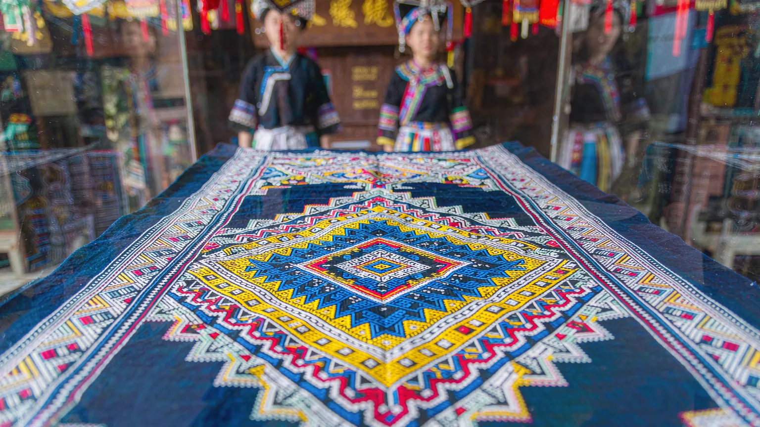 Detailed Li ethnic brocade textile on display at Sanya Romance Park
