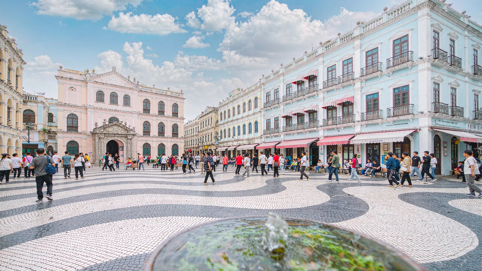 Panoramic view of Senado Square with wave mosaic and pastel colonial buildings