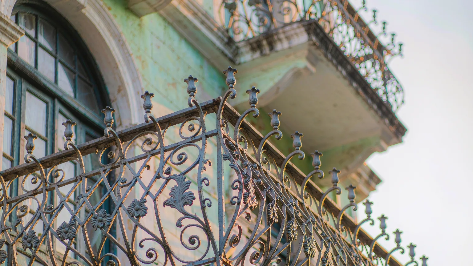 Ornate wrought-iron balcony railing on a colonial building on Shamian Island