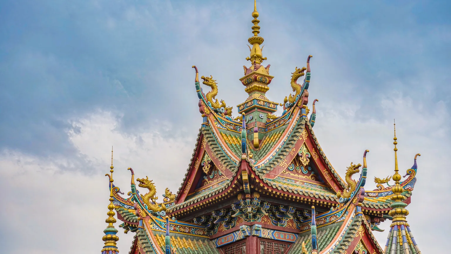 Close-up of Enchanted Storybook Castle's spires and golden finials
