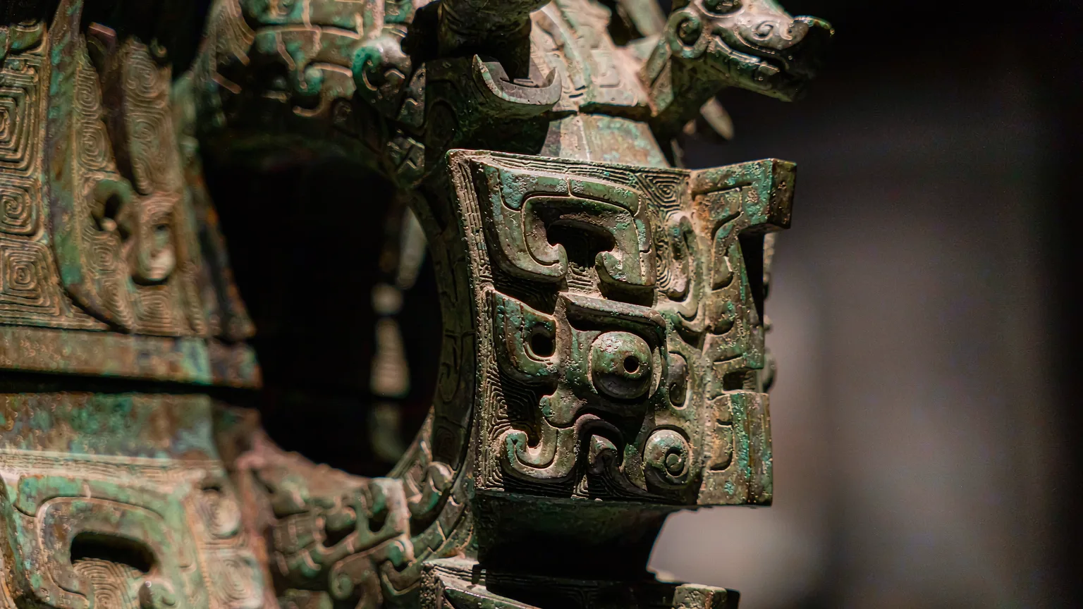 Intricate taotie pattern on an ancient bronze vessel at Shanghai Museum