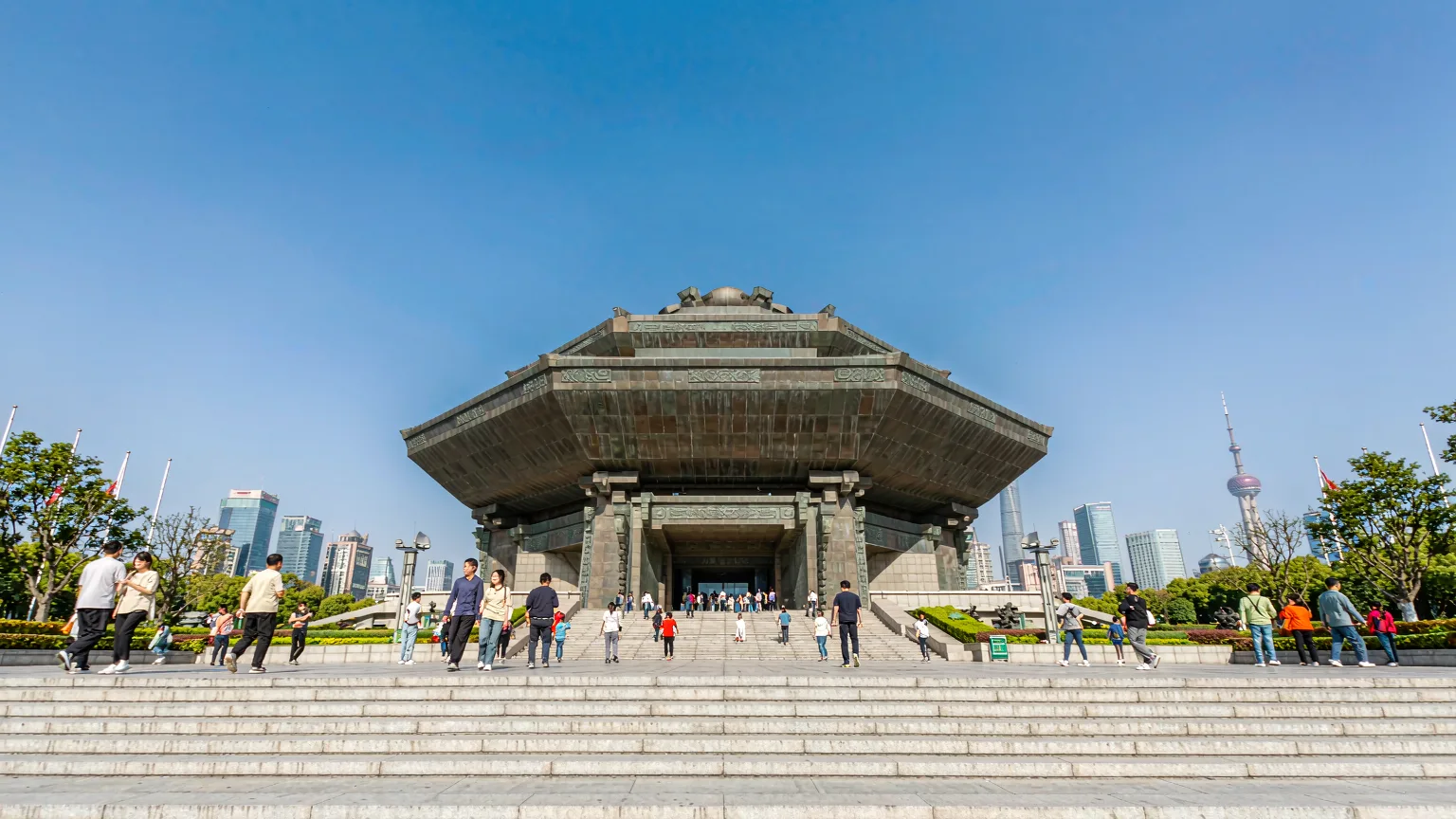 Visitors approaching the grand entrance of Shanghai Museum on a sunny day