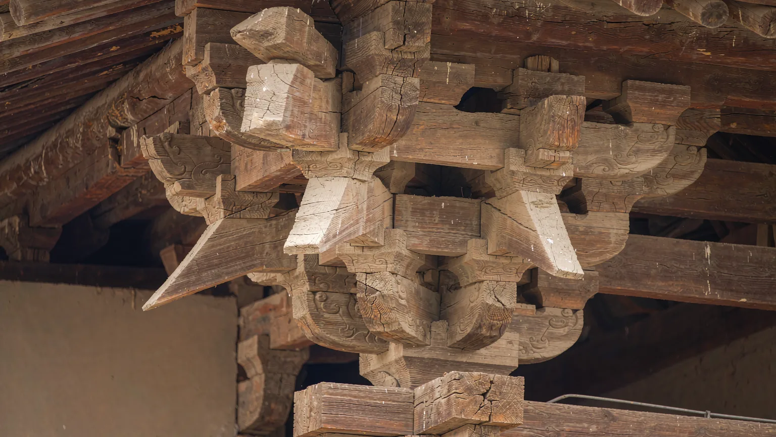 Close-up of intricate wooden dougong brackets at Shanhua Temple