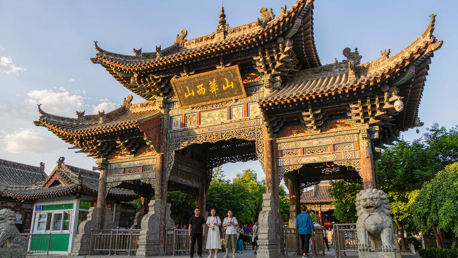 Visitors entering Shanhua Temple through its traditional gate