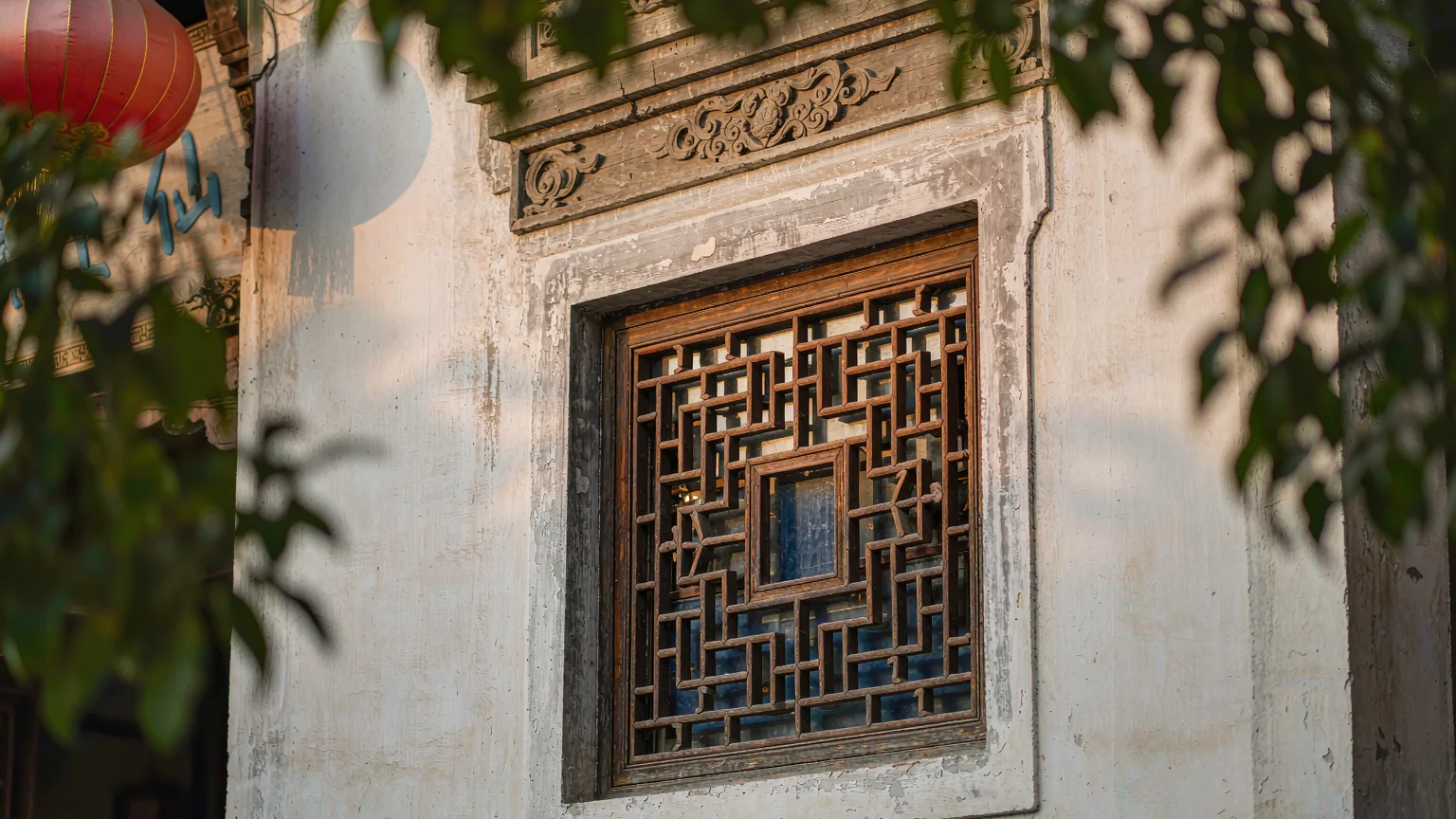 Close-up of ornate wooden lattice window on Shantang Street
