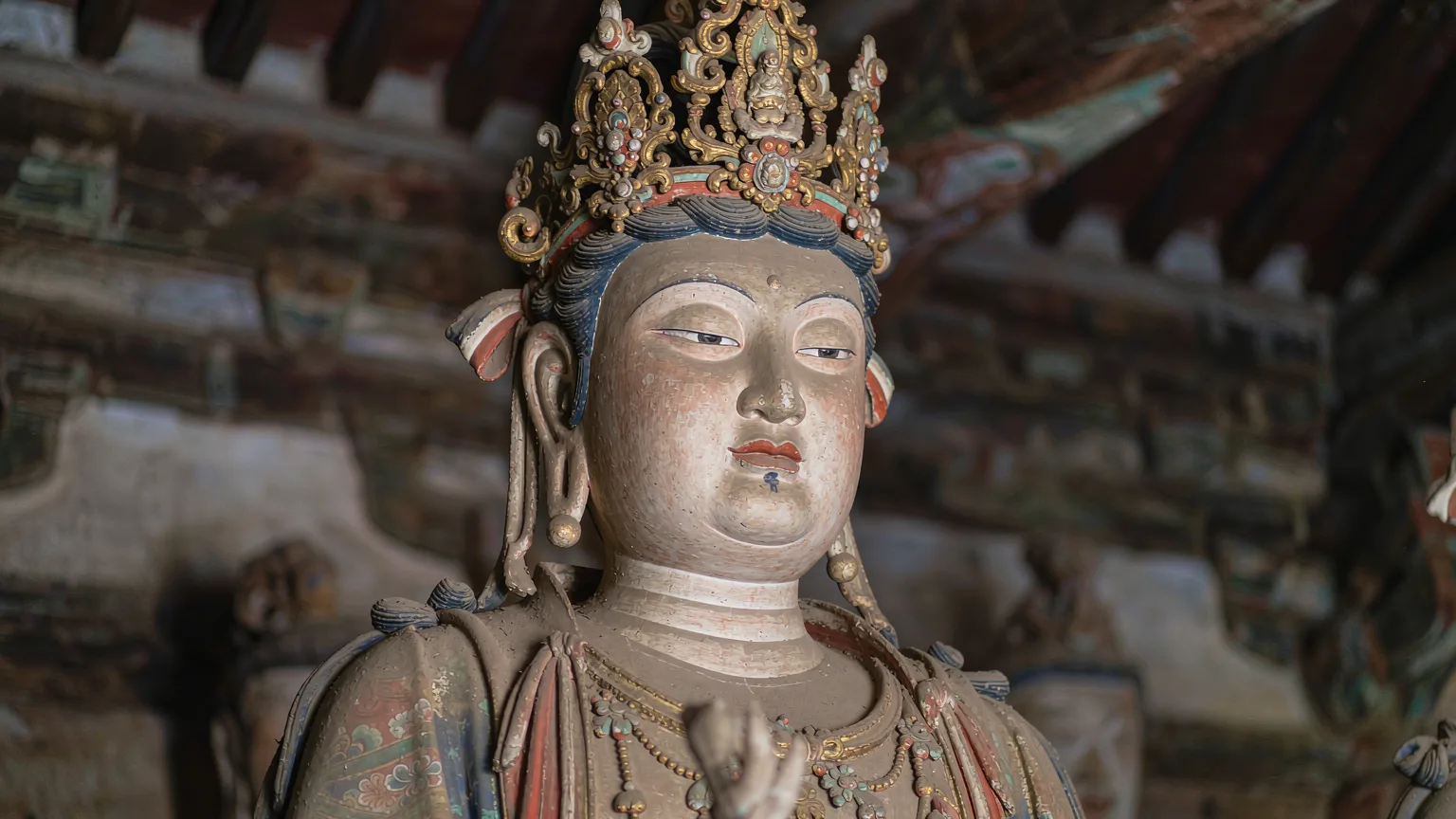Close-up of a painted clay Bodhisattva sculpture at Shuanglin Temple