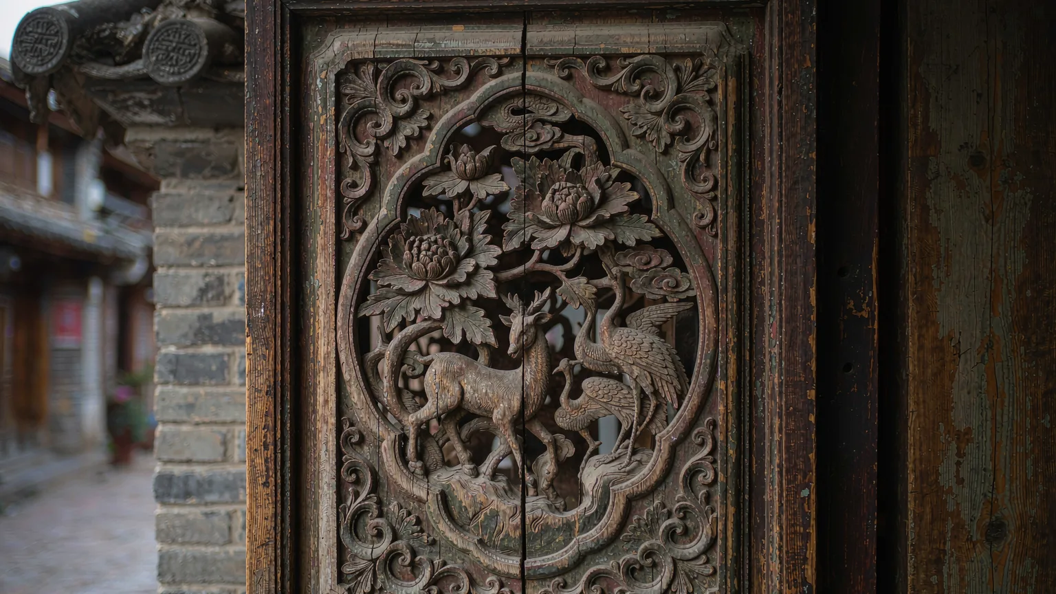 Detailed Naxi woodcarving on a door in Shuhe Ancient Town
