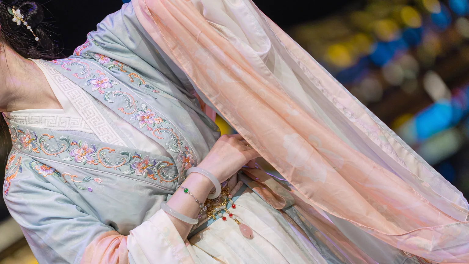 Close-up of embroidered Song-dynasty costume and accessories