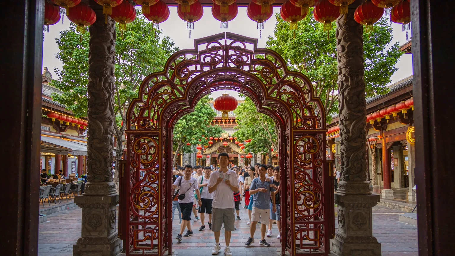 Visitors entering Songcheng theater through ornate Song-style gates