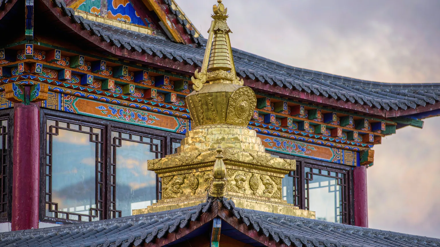 Detailed golden roof ornament and painted eaves of Songzanlin Monastery