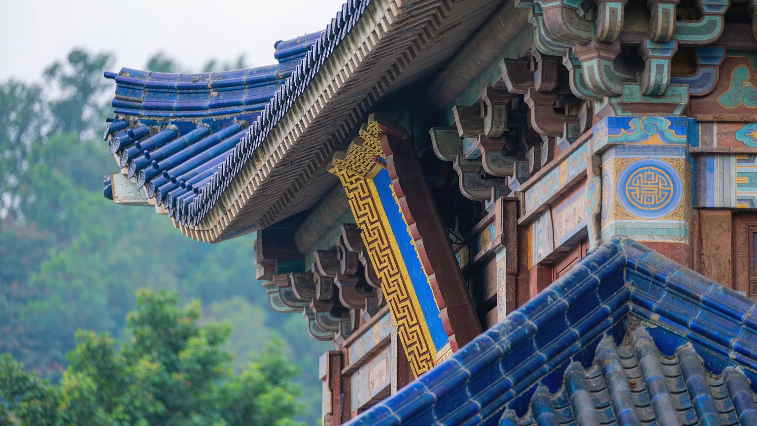 Close-up of blue glazed roof tiles and wooden brackets on Sun Yat-sen Memorial Hall