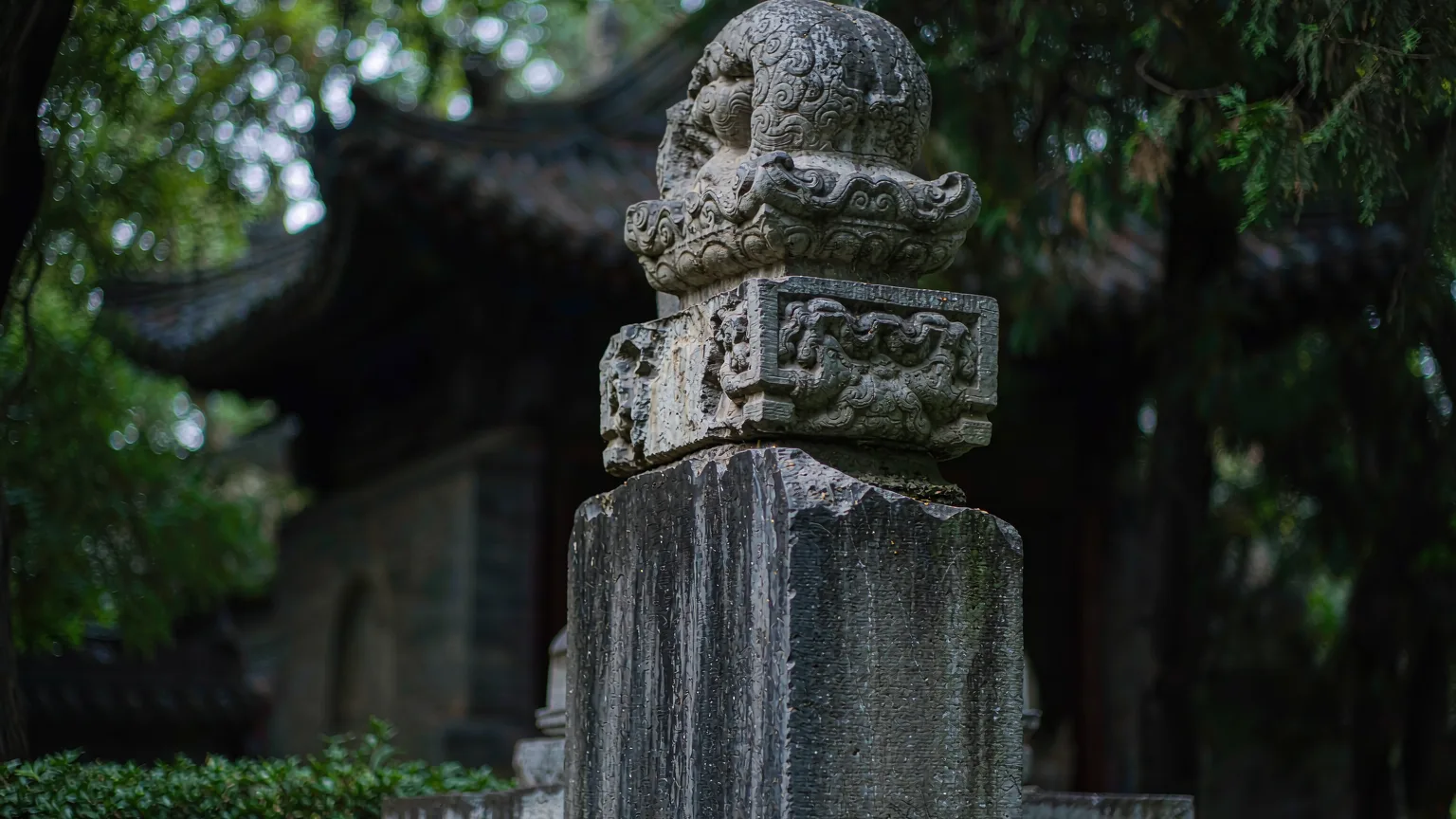 Weathered stone stele with Chinese inscriptions at Temple of Confucius