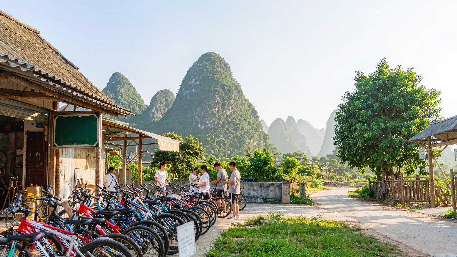 Travelers renting bicycles at the entrance of Ten-Mile Gallery