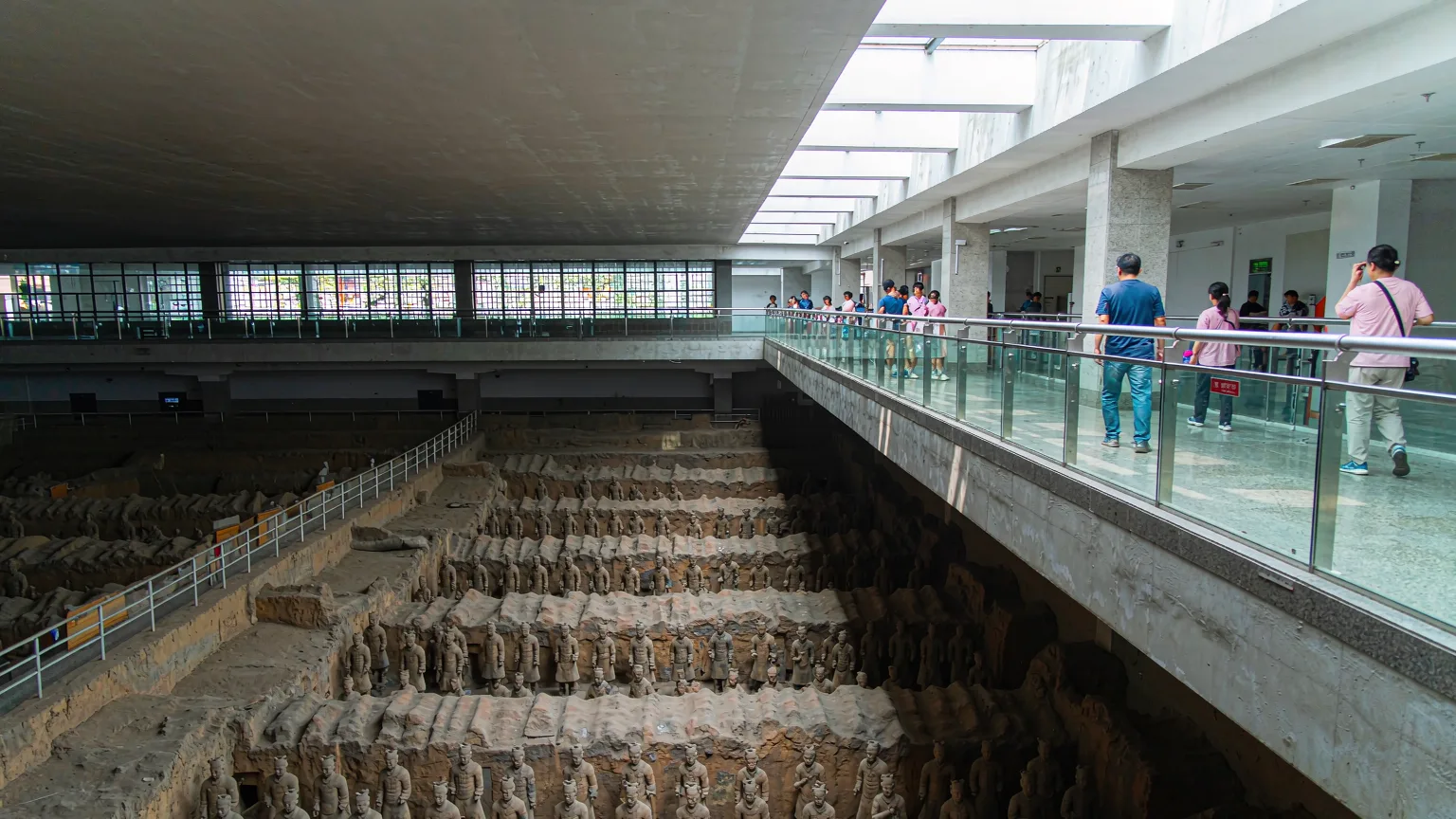Tourists on walkway overlooking terracotta army pit