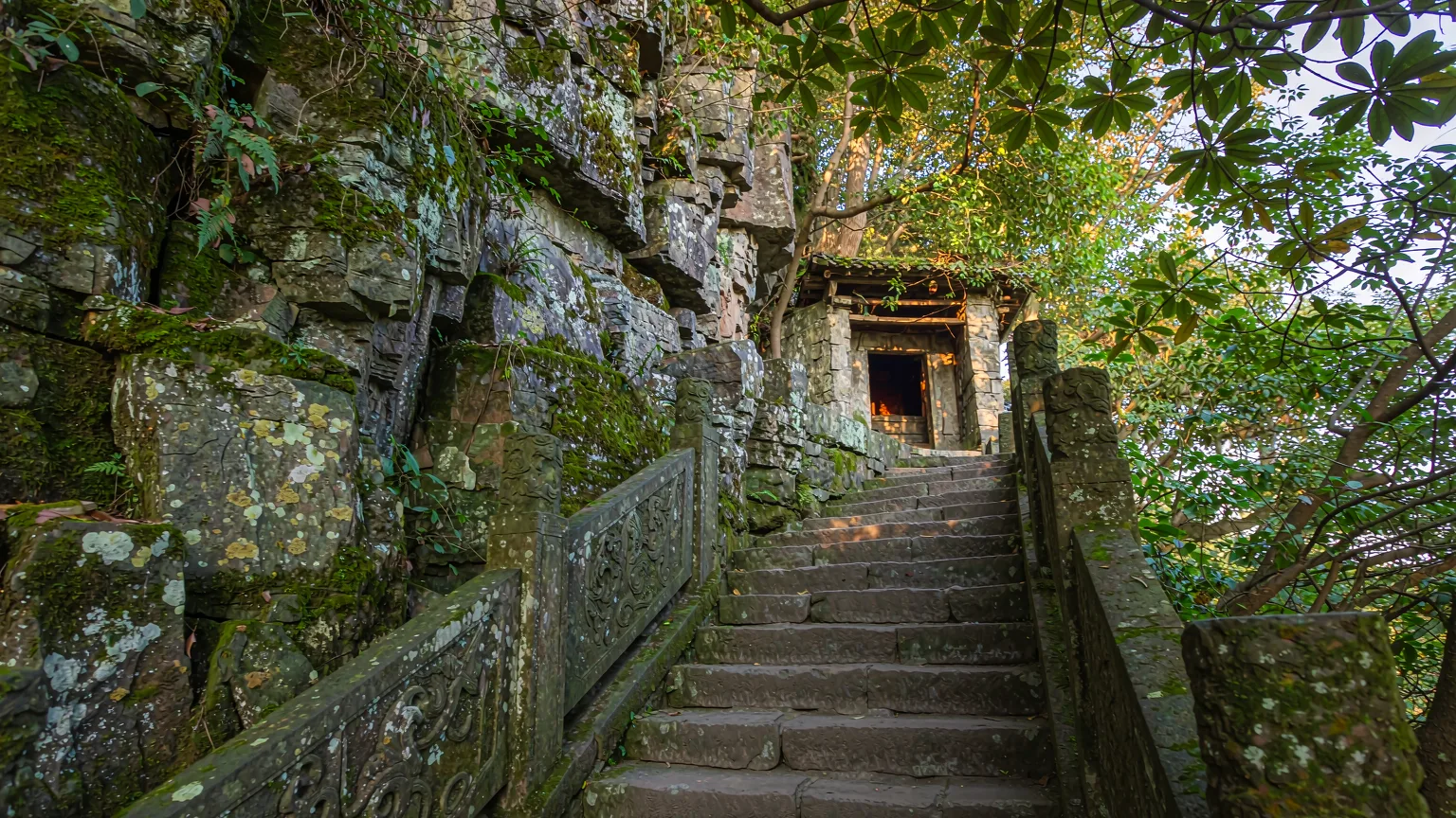 Close-up of ancient stone steps and cliffside shrine on Tianyou Peak