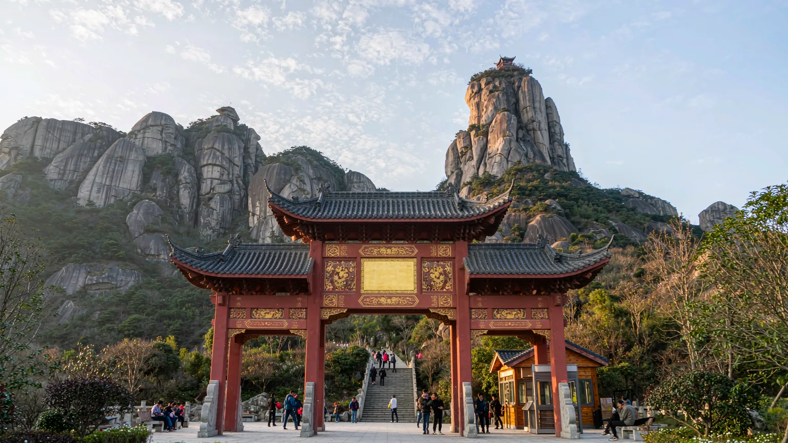 Entrance gate at base of Tianyou Peak with visitors beginning the climb