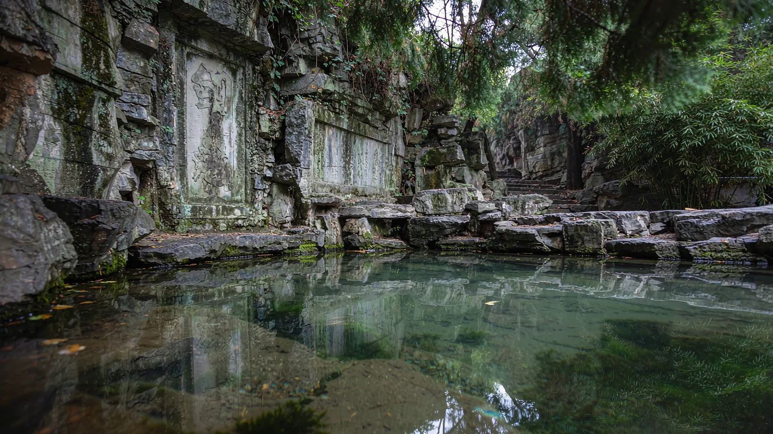 Sword Pool at Tiger Hill with rock carvings and reflections