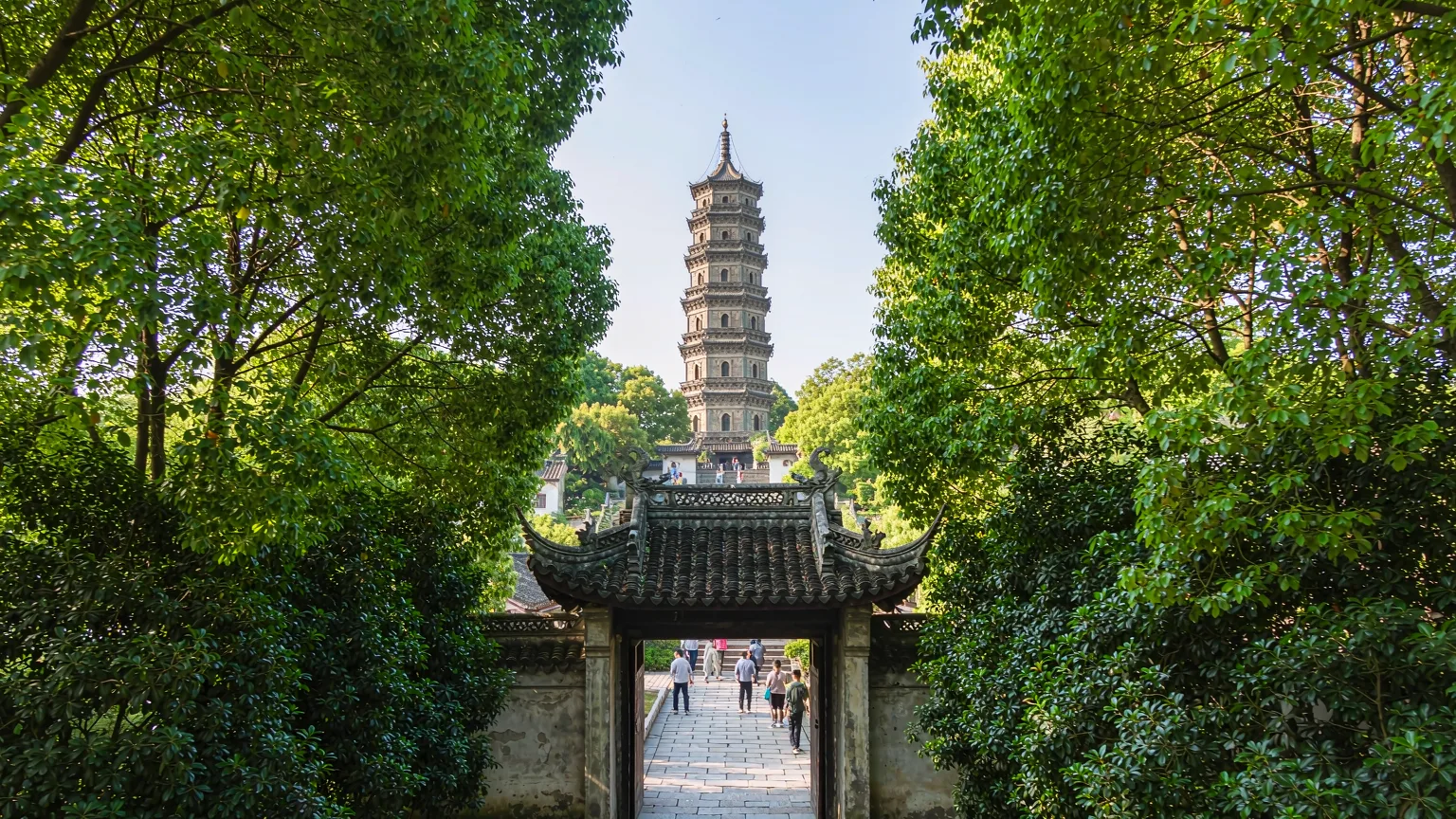 Visitors ascending stone path to Tiger Hill's pagoda, Suzhou