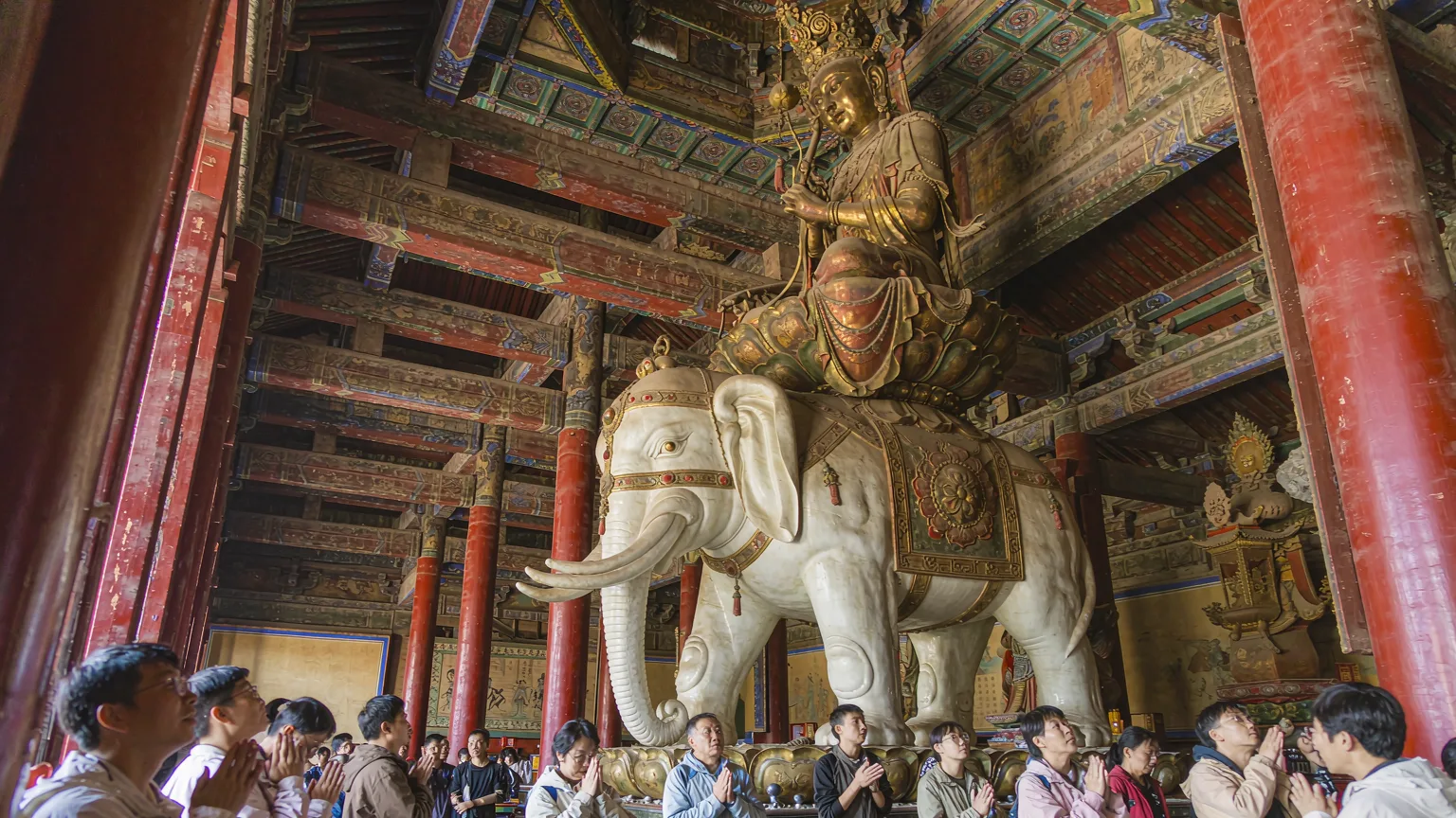 Bronze statue of Samantabhadra on white elephant inside Wannian Temple