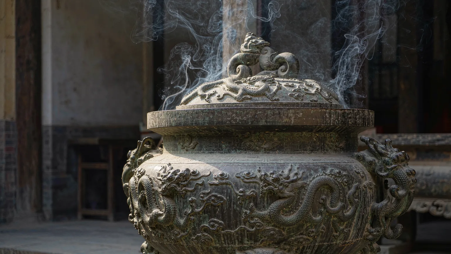 Close-up of ancient bronze incense burner with dragon motifs at Wannian Temple