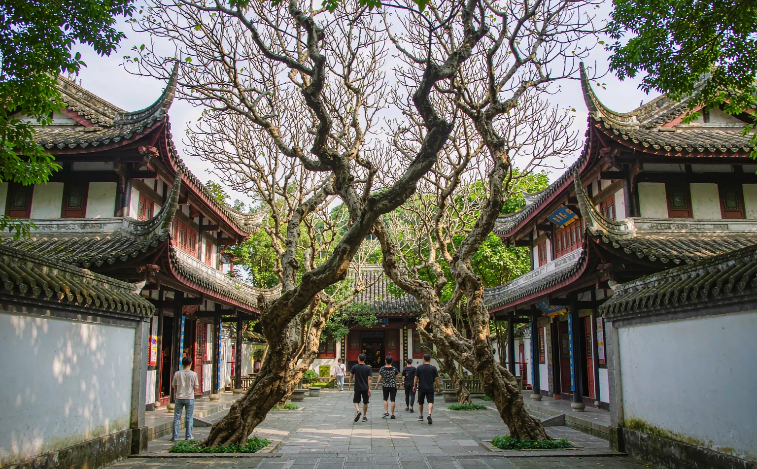 Visitors walking through the courtyard of Wenshu Monastery