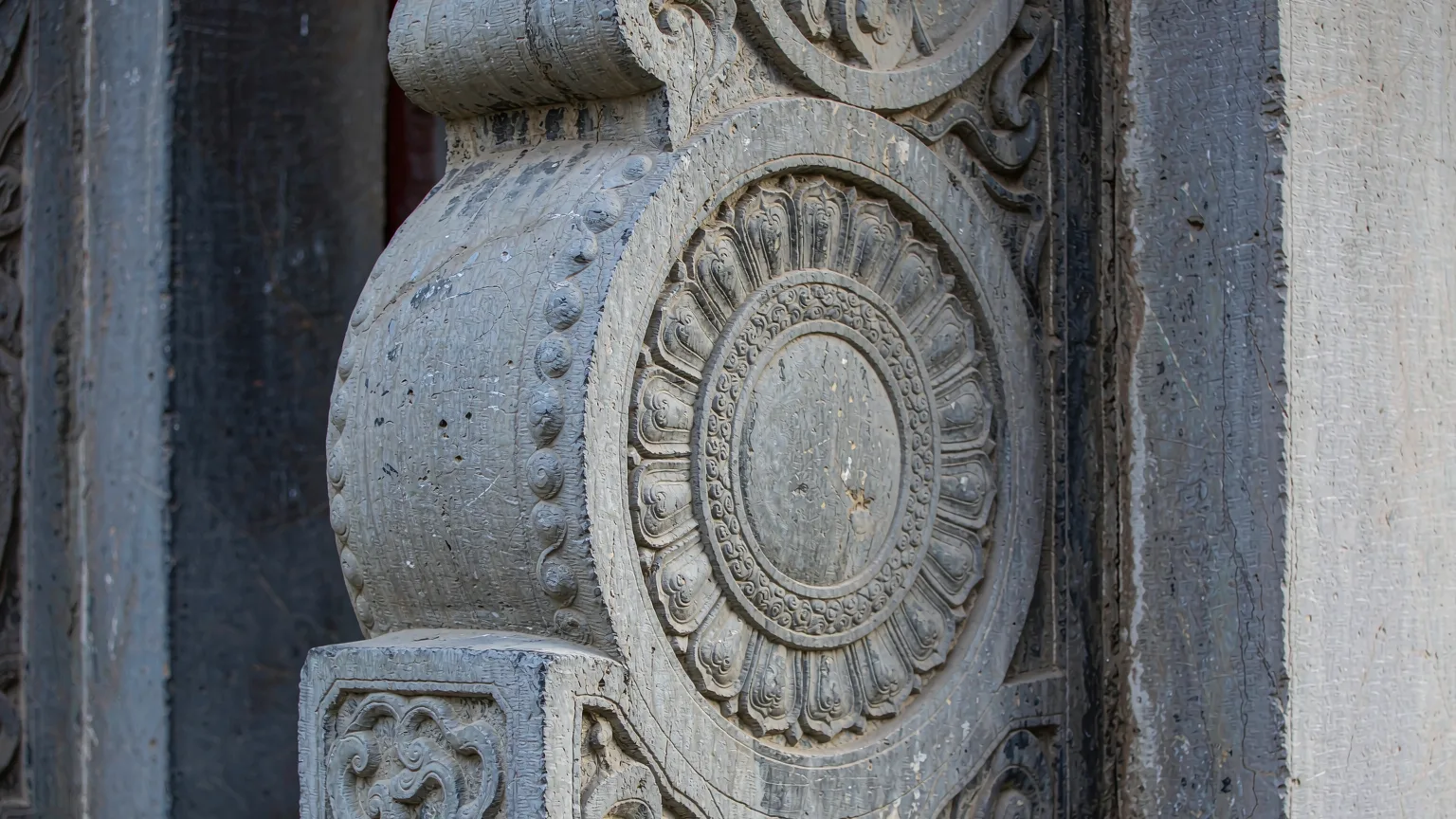 Close-up of ancient stone carving with lotus motifs at White Horse Temple