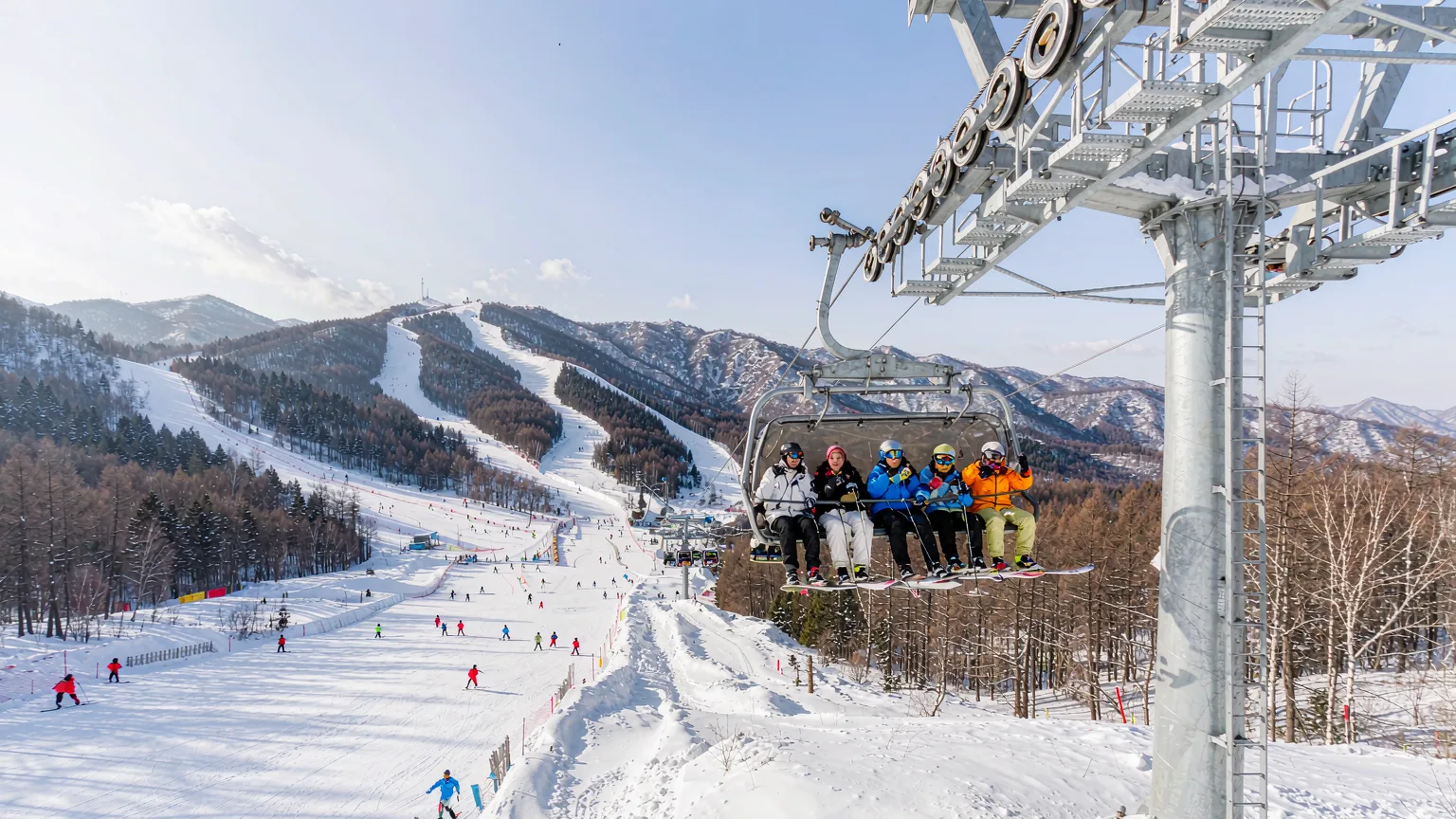 Ski lift carrying visitors up the slopes at Yabuli Ski Resort