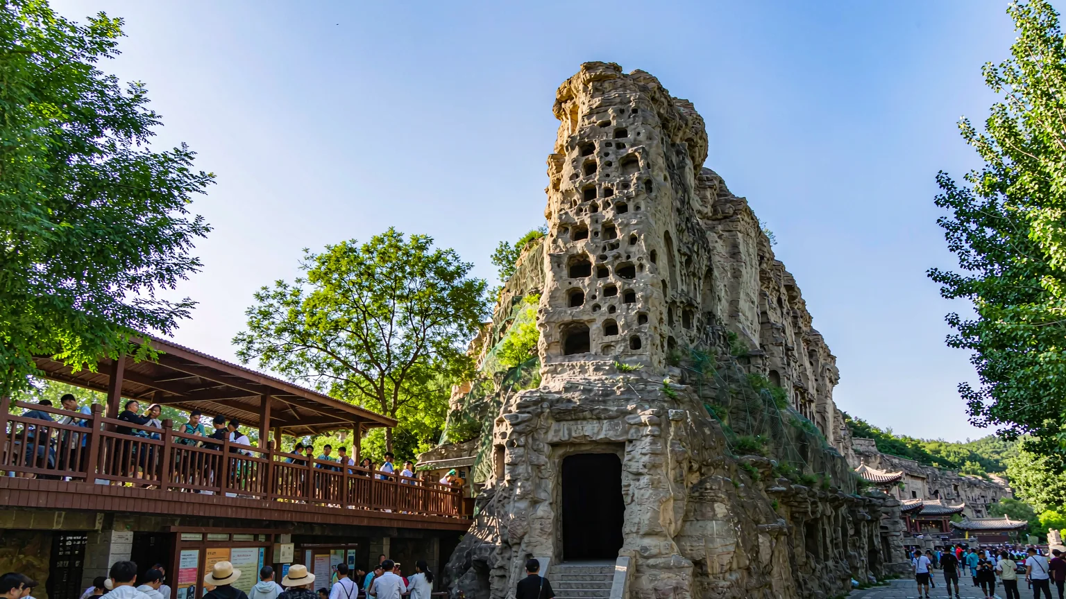 Visitors walking along pathway at Yungang Grottoes entrance area
