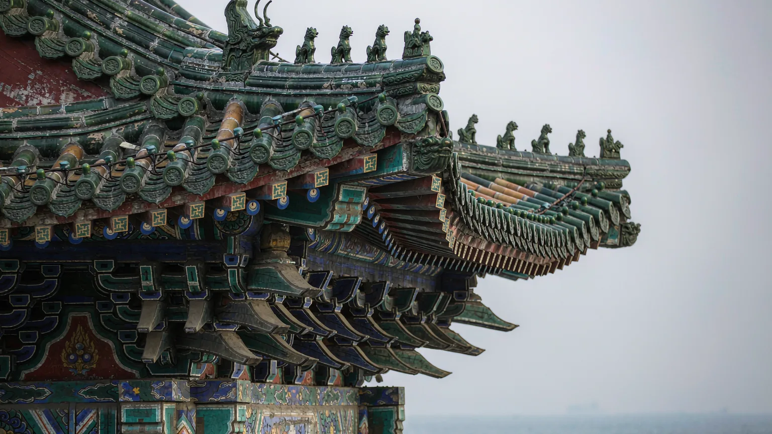 Close-up of ornate roof details of Huilan Pavilion, Zhanqiao Pier, Qingdao