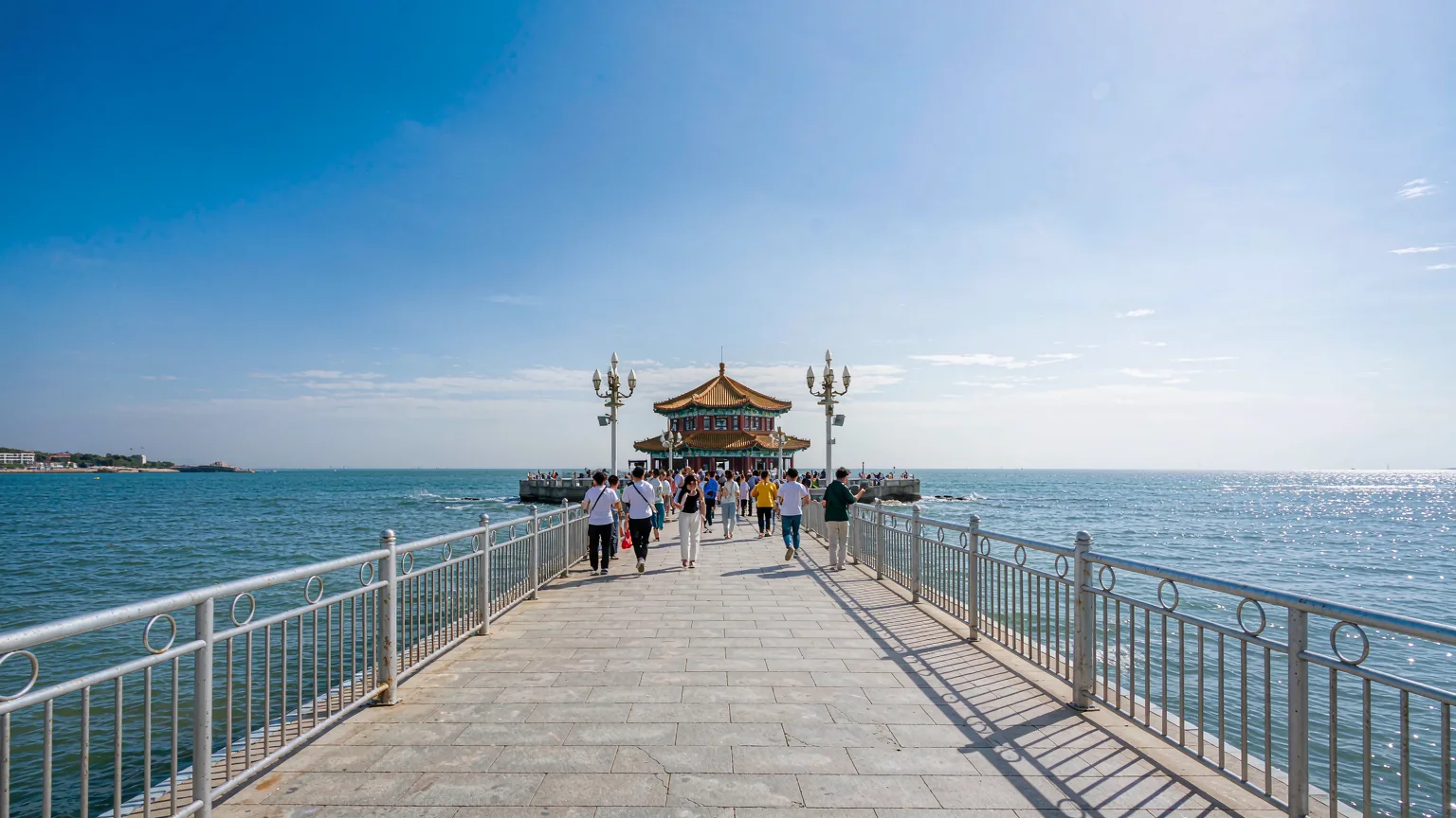 People walking along Zhanqiao Pier towards Huilan Pavilion, Qingdao